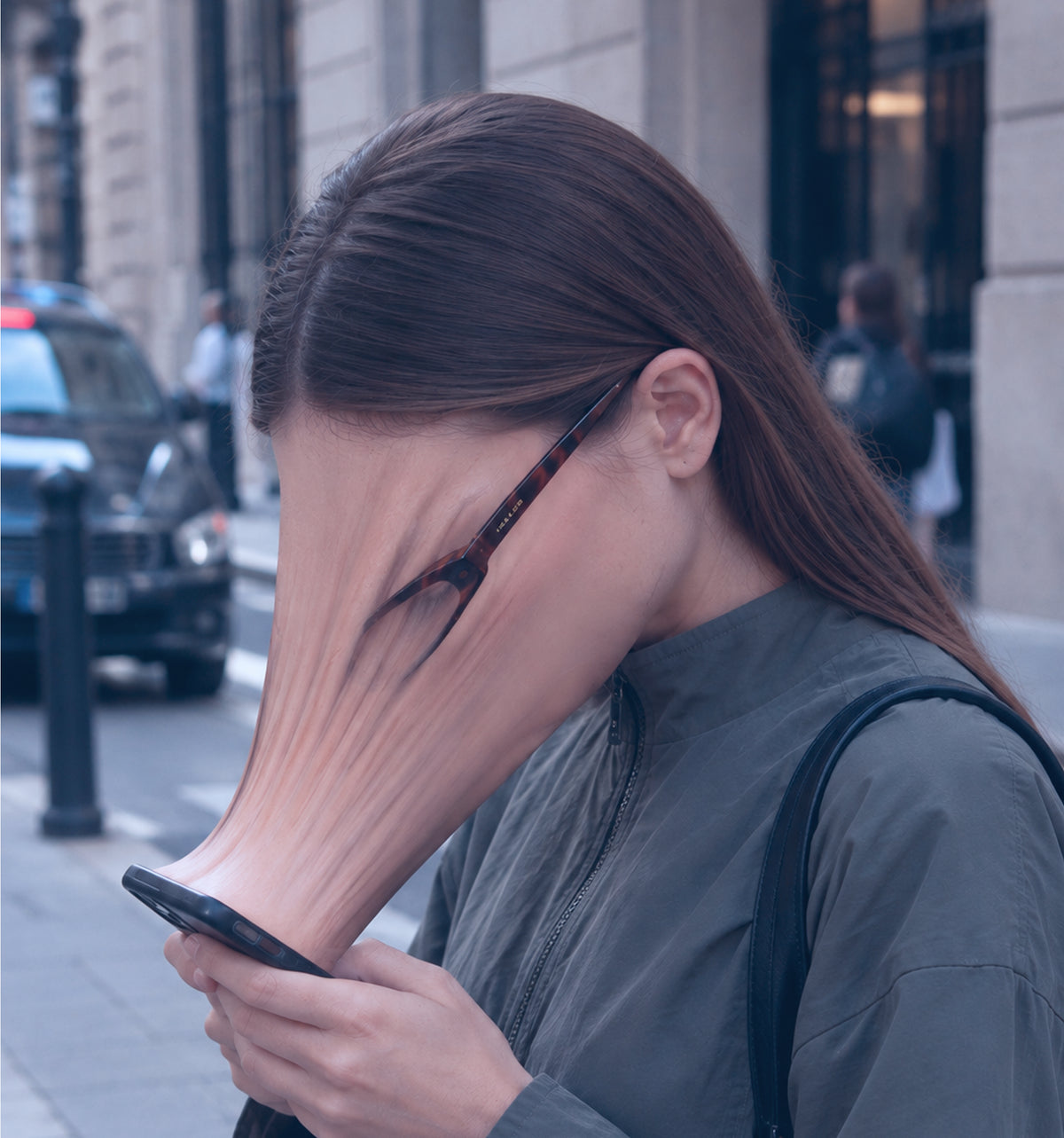 Woman looking down at her phone